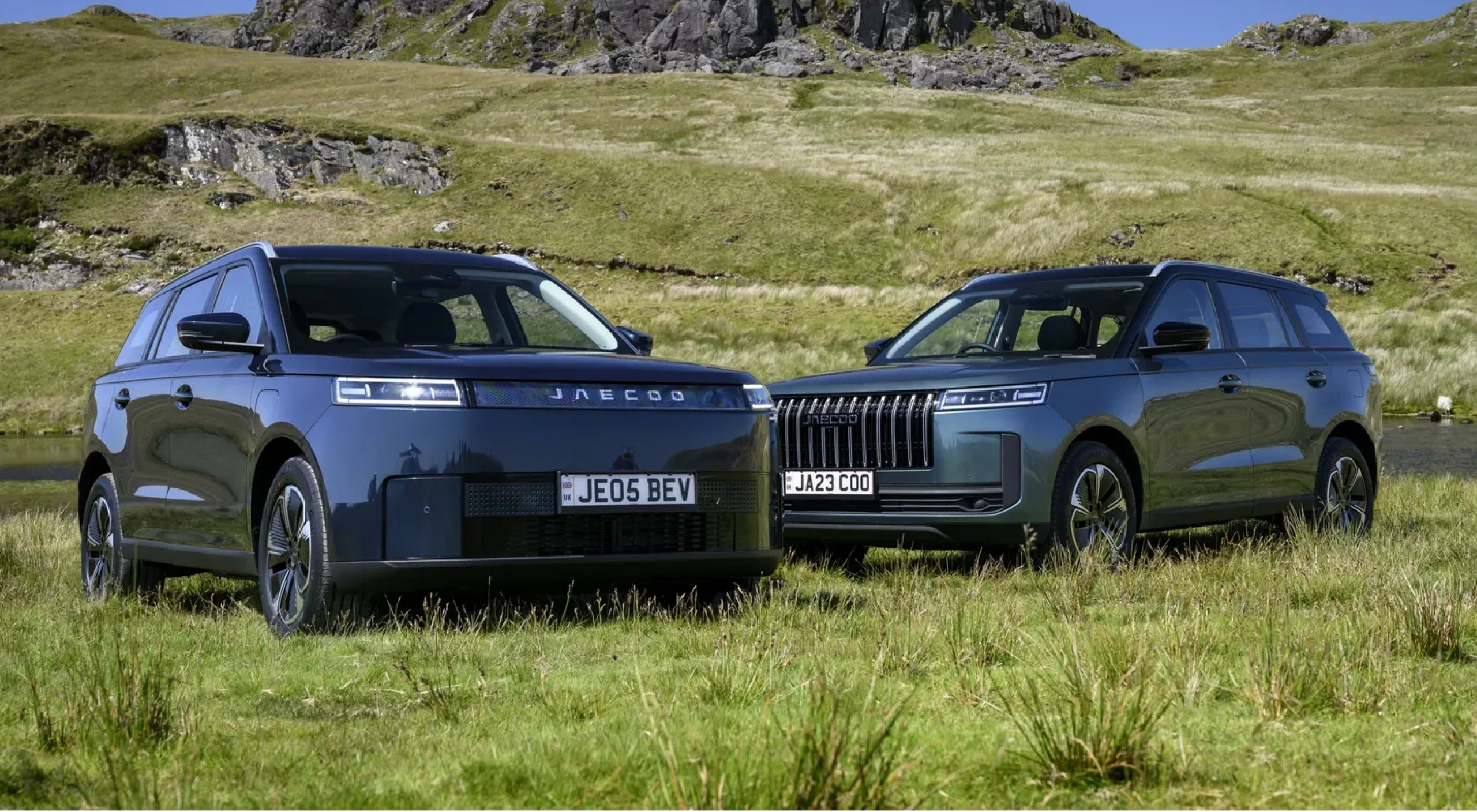 A JAECOO 5 and JAECOO 7 parked side by side on a Highland hillside, with the words JOURNEY WITH JAECOO behind them